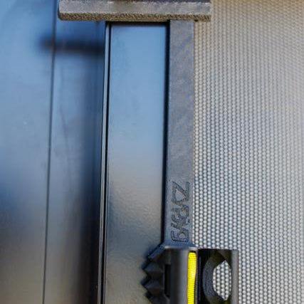 Close-up of a ZypJyg and SypStk with ZypJyg branding on a blurred background
